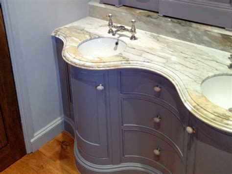 Curved bathroom cabinet and mirrors by Dovetailors