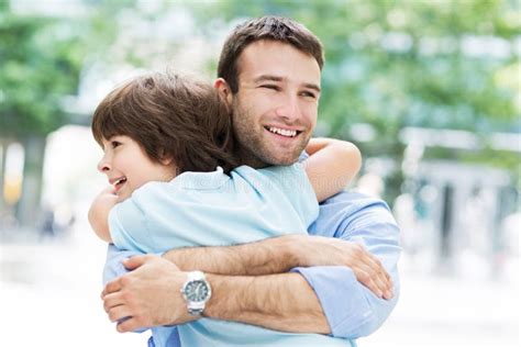 Father and son hugging stock photo. Image of fathers - 55475338