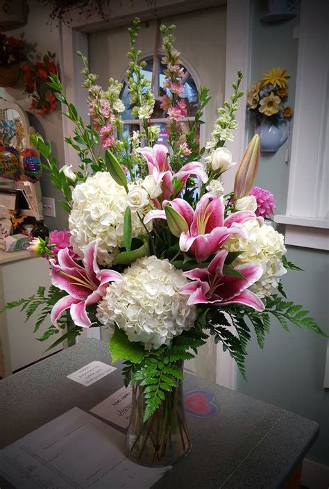 Wow with this arrangement of beautiful stargazer lilies, hydrangea, and larkspur… | Flower ...