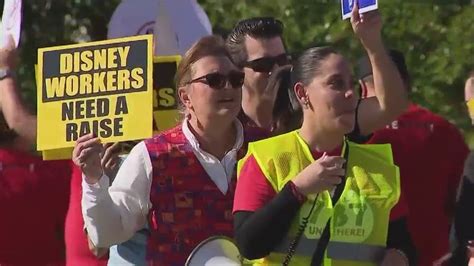 Disney workers rally for a raise in march outside Florida parks | FOX ...