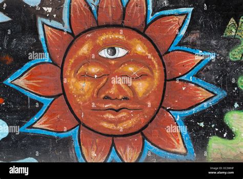 Urban art depicting the sun with a face in the Spanish colonial city of ...