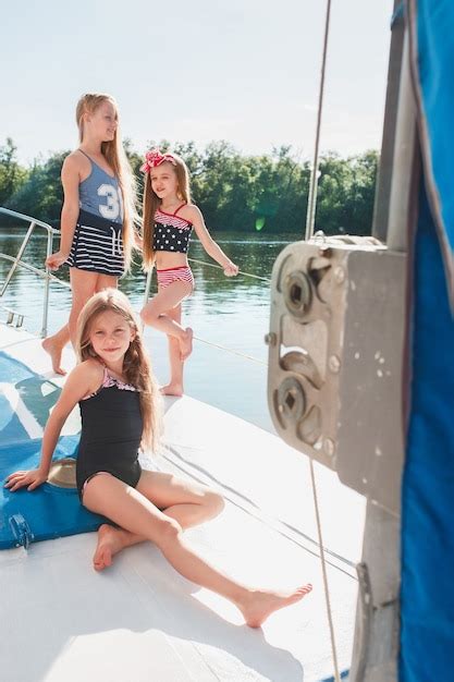 Free Photo | Children on board of sea yacht . teen or child girls against blue sky outdoor.