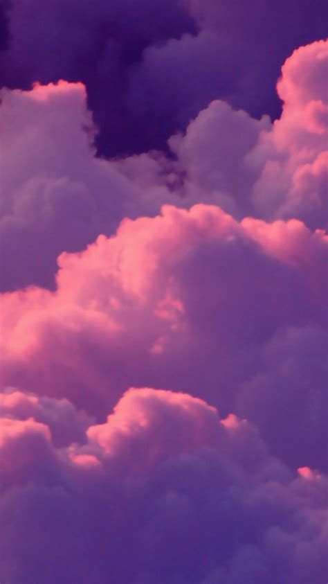 the sky is filled with pink clouds and purple hues in this photo taken ...