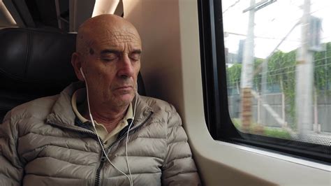 Elderly pensioner calmly sleeping on a train travel to come back home 36497390 Stock Video at ...