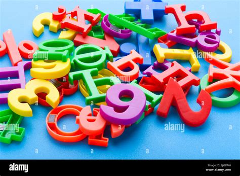 object on blue - toy plastic letters and numbers Stock Photo - Alamy