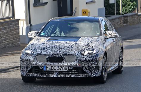 New BMW M135i Hot Hatch Sheds More Disguise In Latest Sighting | Carscoops