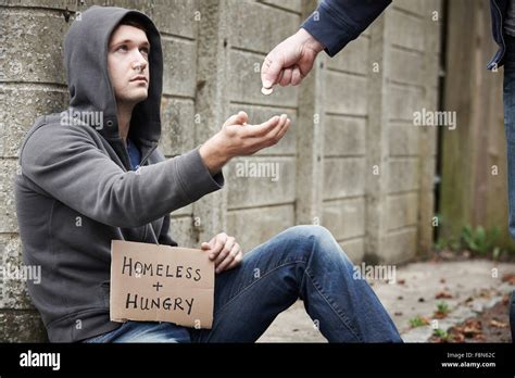 Man Giving Money To Beggar On Street Stock Photo: 91434852 - Alamy