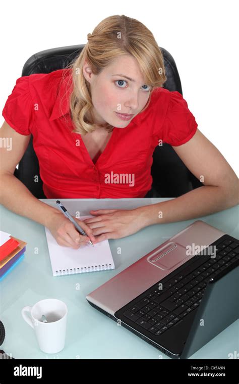 Secretary working at her desk Stock Photo - Alamy