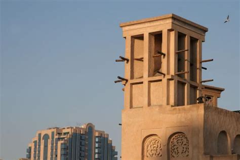 Traditional windtower with modern building in the background | Dubai modern architecture | Dubai ...