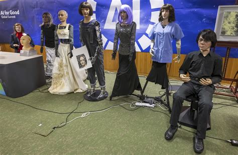 A creepy collective of nine AI robots showcased at UN news conference ...