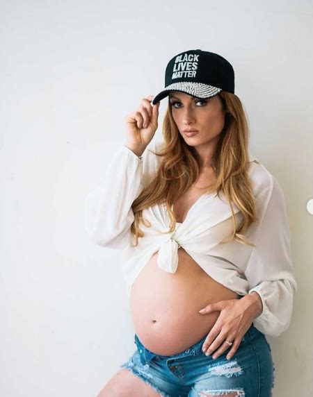 Irish WWE star Becky Lynch shows off baby bump while wearing Black ...