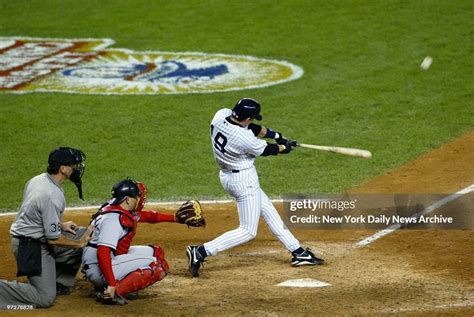 New York Yankees' Aaron Boone hits a solo home run in the 11th inning... News Photo - Getty Images