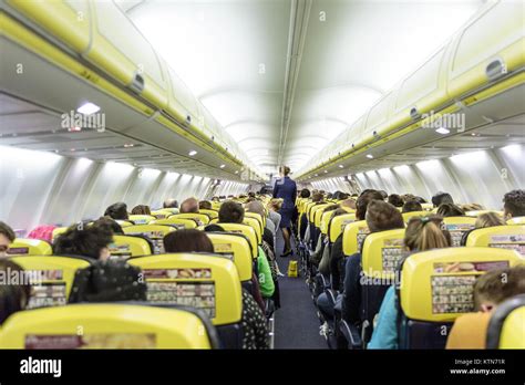 Interior of commercial airplane during flight Stock Photo - Alamy