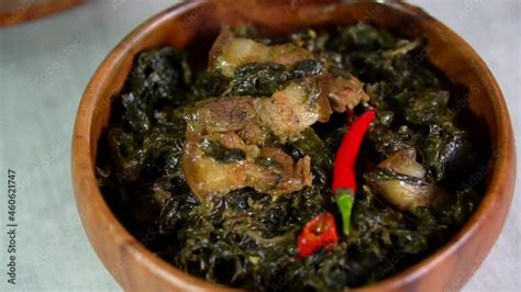 Laing is a Filipino dish of shredded or whole taro leaves with meat or seafood cooked in thick ...