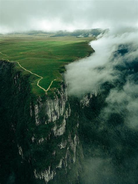 Photo of a Fortaleza Canyon Cliff Surrounded by Clouds · Free Stock Photo