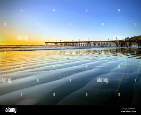 Pismo beach pier sunset Stock Photo - Alamy