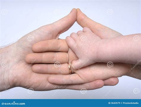 Baby's Hand Holding The Hands Of Parents Royalty Free Stock Images ...