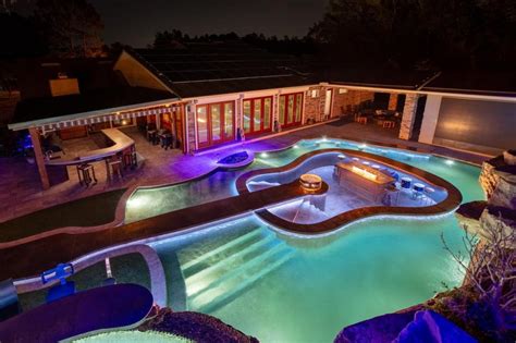 This Guitar Shaped Pool Features a Rock Waterfall and Swim-up Bar - Mad ...