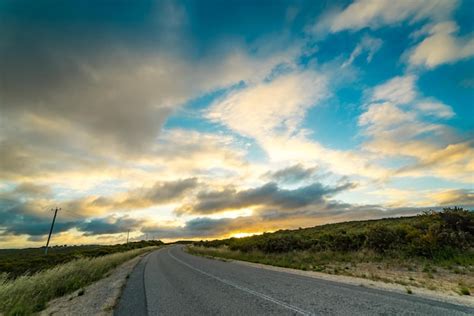 Premium Photo | Picturesque landscape scene and sunset above road