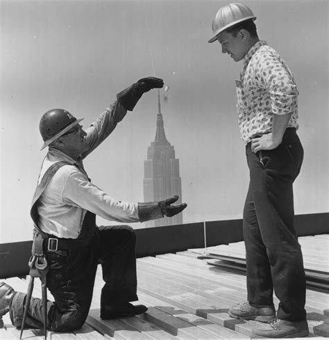 Construction workers on the 59th floor of the Pan American Building in New York. The Empire ...