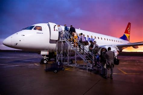 Airplane on Tarmac with Passengers Boarding Editorial Stock Image - Image of aerospace ...