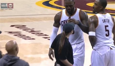 LeBron James grabs beer bottle during game | Larry Brown Sports