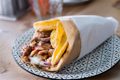 Traditional Greek Food Gyros Pita with Fries, Vegetables and Tzatziki Sauce Stock Photo - Image ...