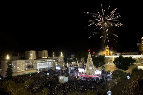 Thousands gather in Bethlehem for Christmas tree lighting | The Times of Israel