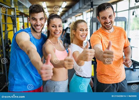 Group of Young Fit People Doing Exercises in Gym To Stay Healthy Stock ...