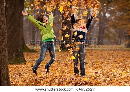 Child jumping in leaves Stock Photos, Images, & Pictures | Shutterstock