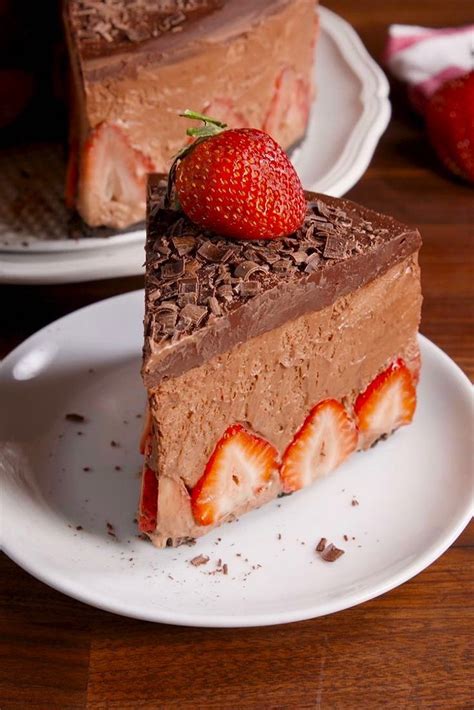 a piece of chocolate cake with strawberries on top