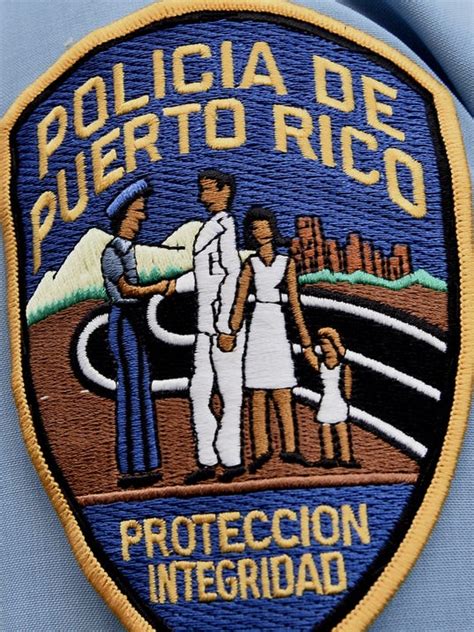 Puerto Rico cop held in killing of 3 officers