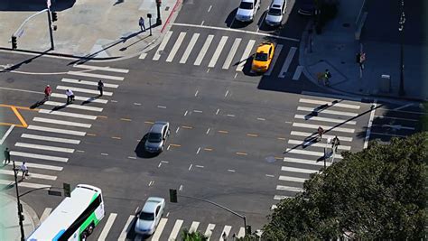 Traffic Intersection Timelapse With Cars And Pedestrians. Zoom Out From ...