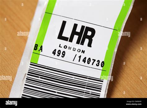 An airline baggage tag shows the three letter airport code for Heathrow ...