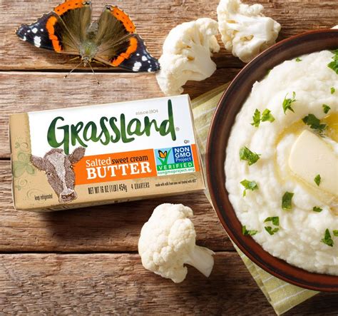 a bowl of mashed cauliflower next to a box of grasland butter