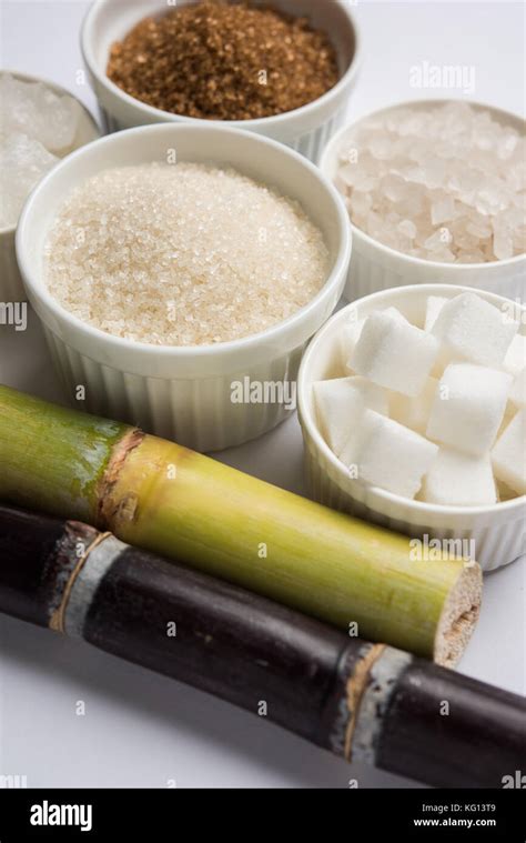 Jaggery, Sugar Variety and Sugarcane - by-products of Sugar Cane or Ganna placed over moody ...