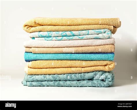 Different colors of towels isolated on white background Stock Photo - Alamy