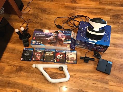 PS4 vr with 5 games , two move controllers, camera, vr aim controller, charging stand | in Ebbw ...