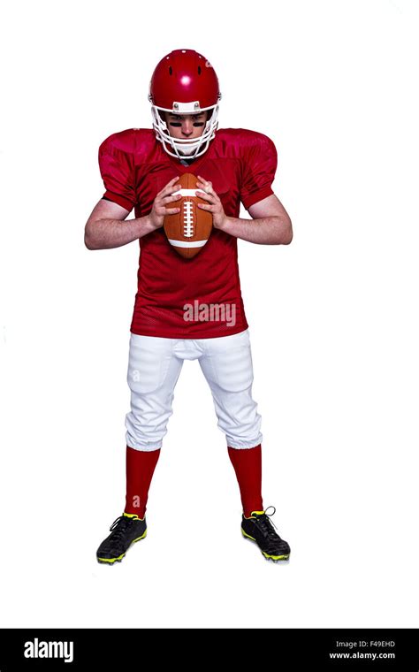 American football player holding a ball Stock Photo - Alamy