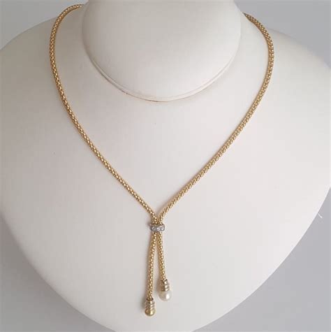 18 kt Collar de oro amarillo tipo corbatín con una perla - Catawiki