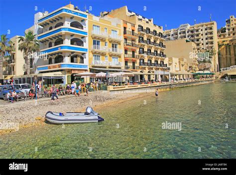 Waterfront hotel buildings beach and sea at Xlendi, island of Gozo, Malta Stock Photo - Alamy