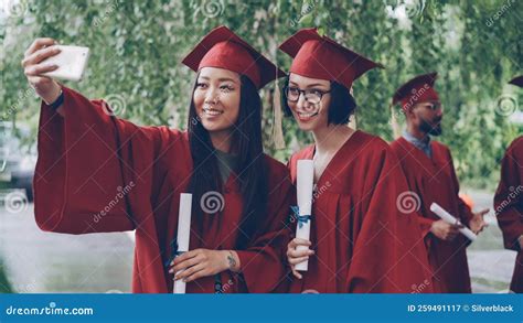 Pretty Girls Graduating Students are Taking Selfie with Diploma Scrolls ...