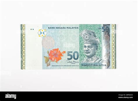 a 50 Malaysian Ringgit banknote on a white surface Stock Photo - Alamy