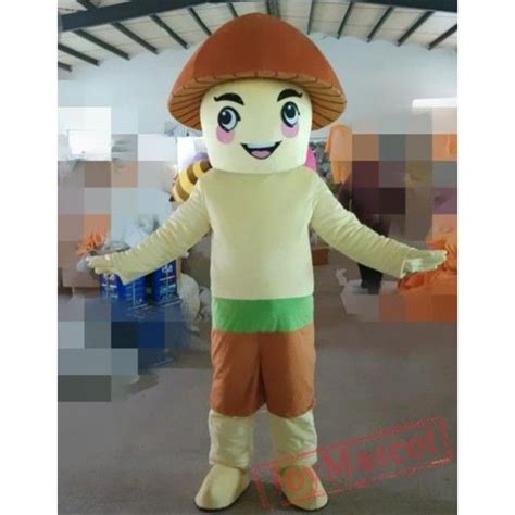 a person in a mushroom costume standing with his arms out and hands out to the side