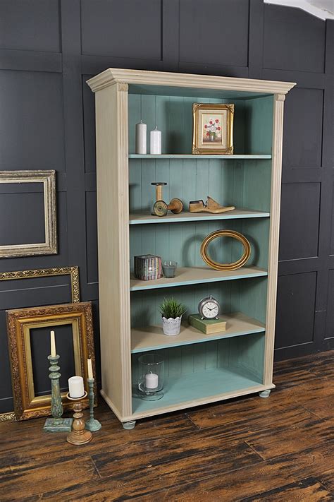 This farmhouse pine bookcase has been painted in Annie Sloan Country Grey with a lightened ...