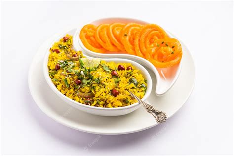 Premium Photo | Aloo Poha with Jalebi snack combination also called ...