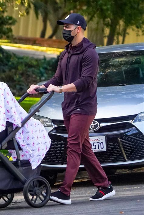 Joe Jonas in a Purple Hoodie Takes His Daughter Willa on a Walk in Los ...