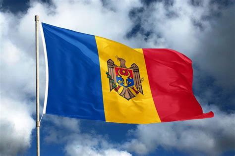 Moldova flag on sky and cloud background national symbols of moldova ...