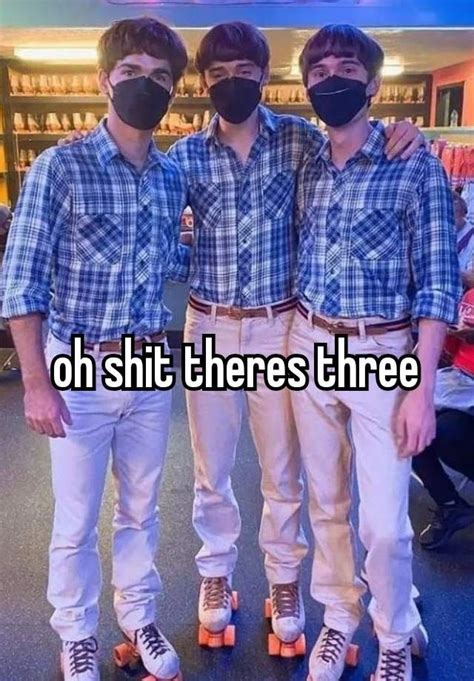 three young men wearing masks and standing next to each other in front of a bookshelf