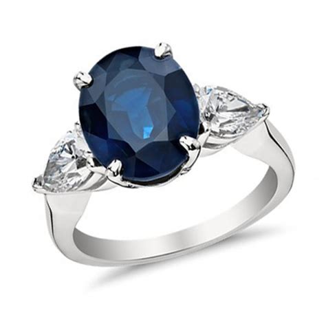 9.33 ct Oval Shape Sapphire With Pear Shape Diamond Anniversary Ring